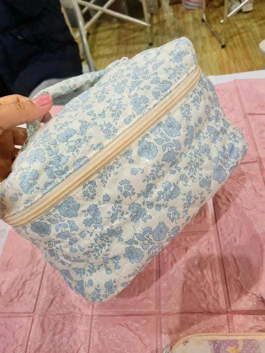 Blue quilted floral design bag